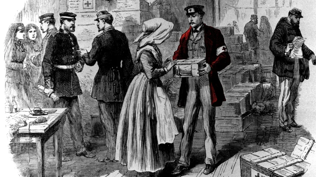 19th-century engraving: volunteers wearing white armbands marked with a red cross hand out boxes of supplies in a crowded depot, while soldiers and nurses talk nearby.